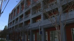 Woman wakes to naked man breaking in to her Atlanta apartment