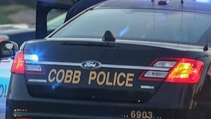 Woman charged with neglect after elderly man found dead in Cobb home