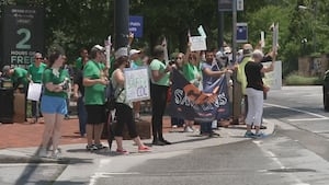 Protesters rally outside CDC offices in DeKalb County after advisory committee fired