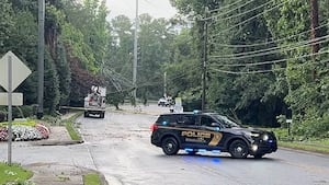 Line of heavy storms moves across GA, killing 1, causing damage across the state