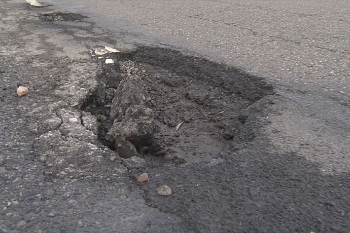 Syracuse Public Works takes advantage of warm weather, filling potholes