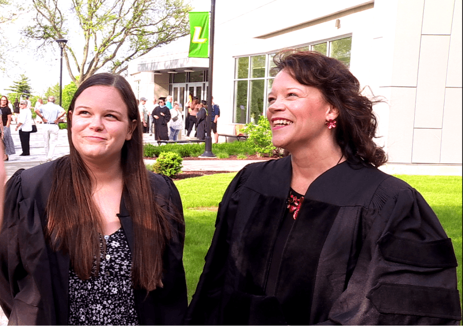 Mother and daughter walk across Le Moyne College graduation stage together