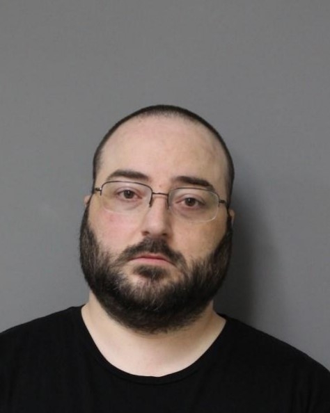Avon man accused of drawing swastika on a Tesla