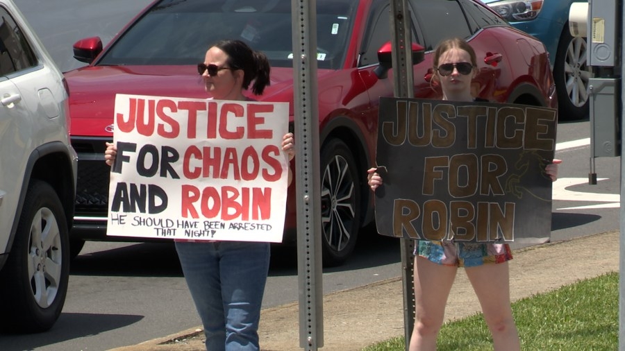 Friends and family protest, demanding justice for Robin Massey, who was killed in an accident while on horseback
