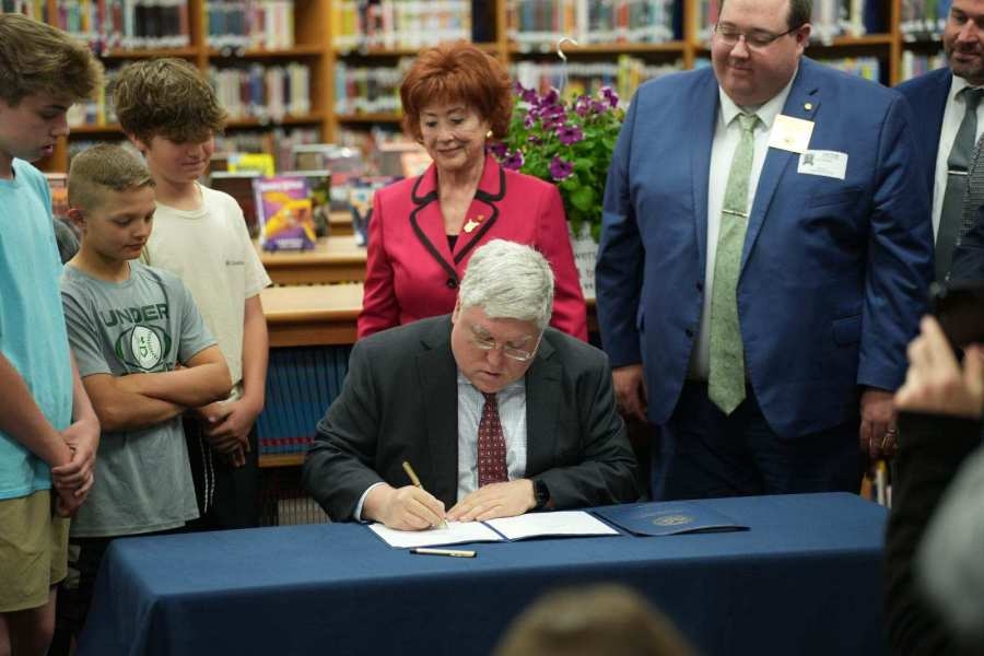 Governor Morrisey signs bills banning cell phones in classrooms and requiring U.S. Motto displayed in schools