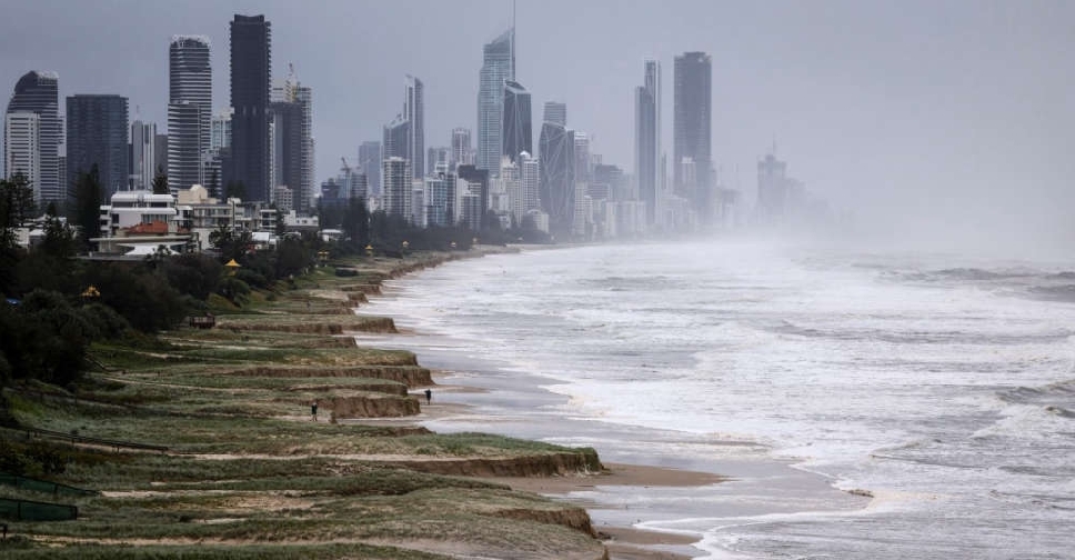 Cyclone Alfred downgraded as millions stay indoors