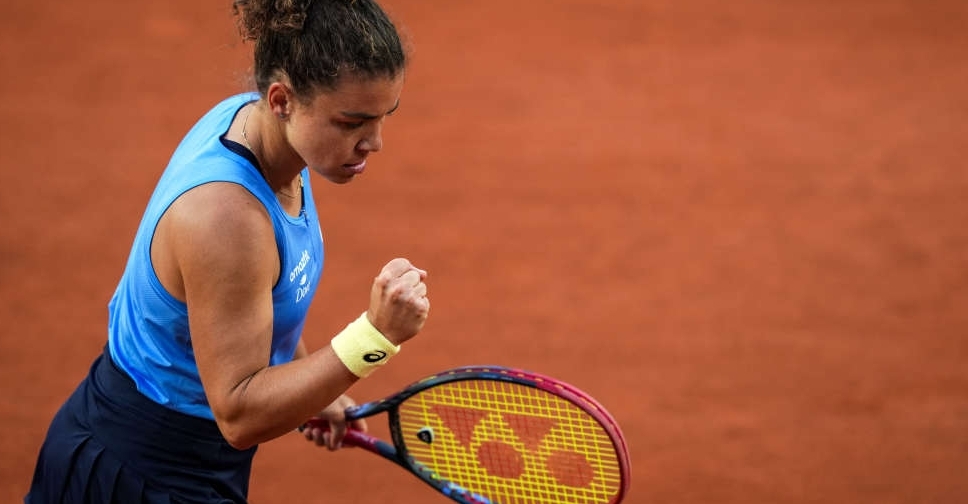 Big names crash but Italians shine on damp day at French Open