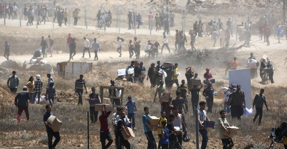At least 27 Palestinians killed near Gaza aid site, medics say