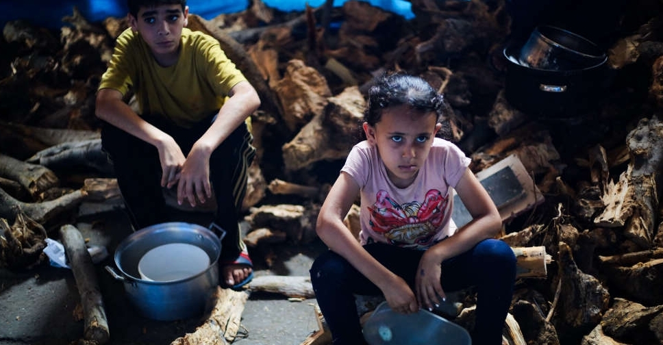 American group distributing aid in Gaza delays reopening sites