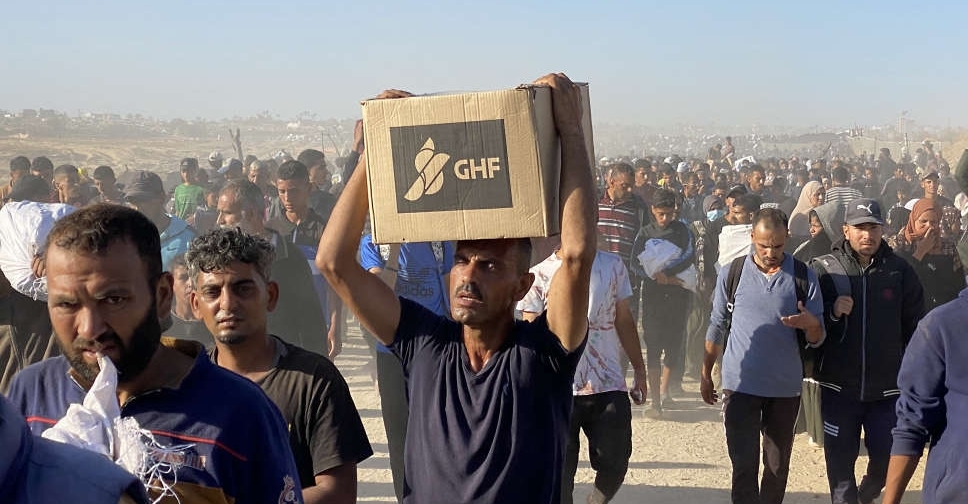 US group distributing aid in Gaza reopens sites