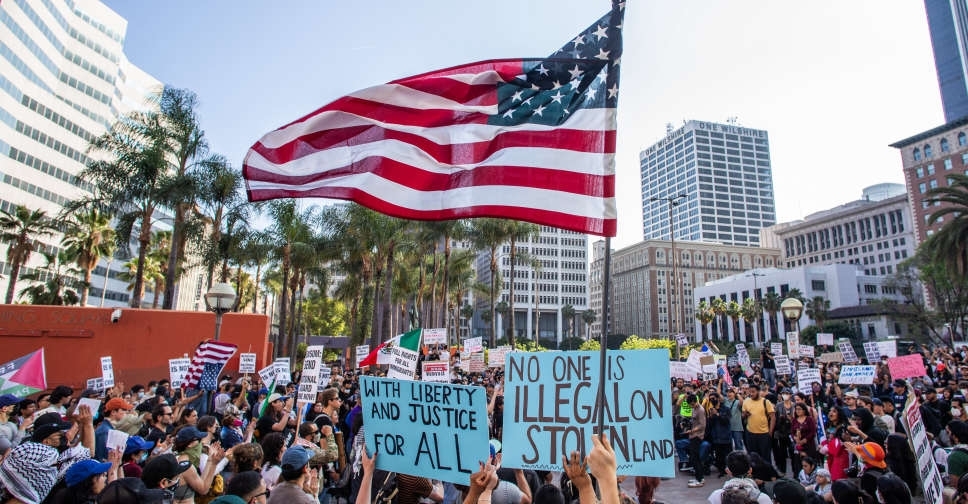 Troops in LA can detain individuals, military official says, as protests spread