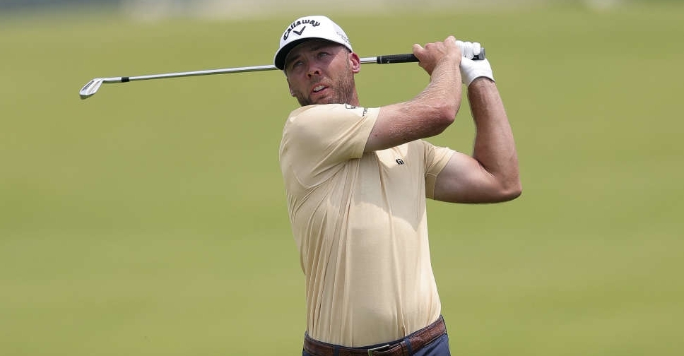 Burns leads US Open, McIlroy squeaks into weekend