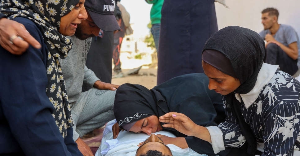 Israeli fire kills 35 people in Gaza, many at aid site, medics say