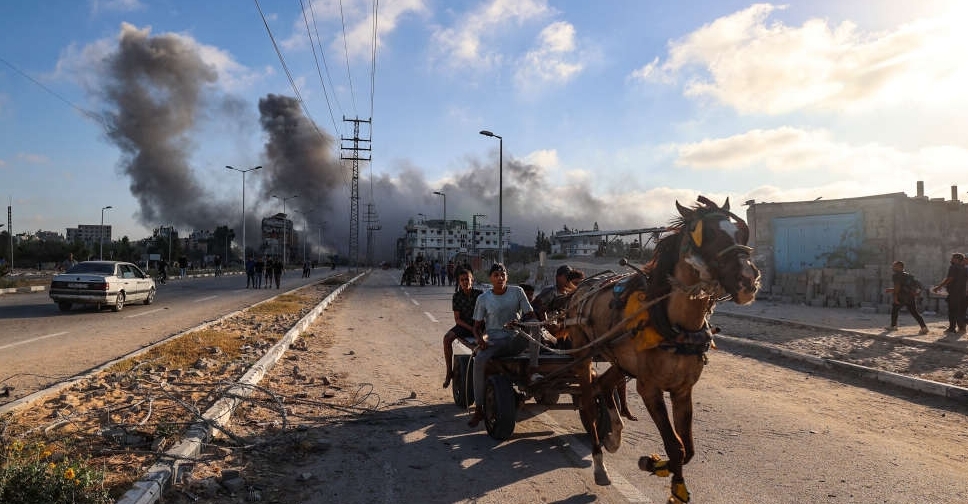 Israeli attacks kill at least 21 people in Gaza, medics say