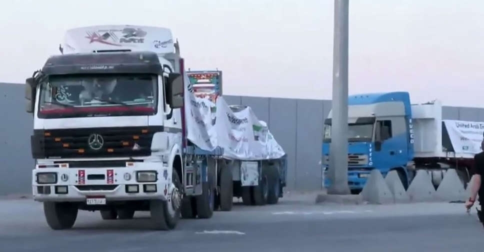 Aid trucks move from Egypt to Gaza after Israel said it began airdrops