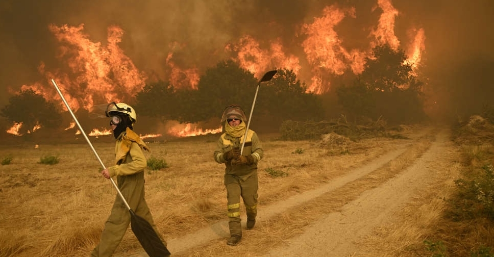 Spain battles 14 major fires with more expected