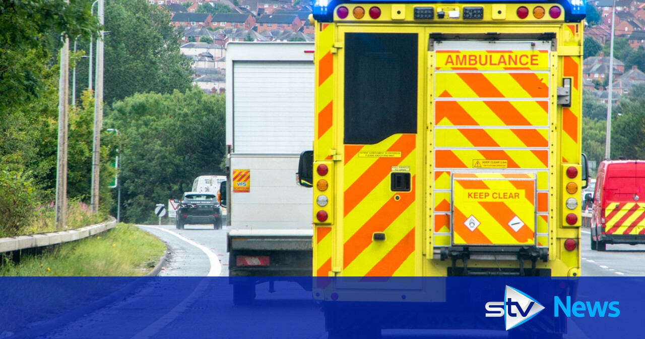 Paramedic accused of driving through red light and crashing ambulance into car