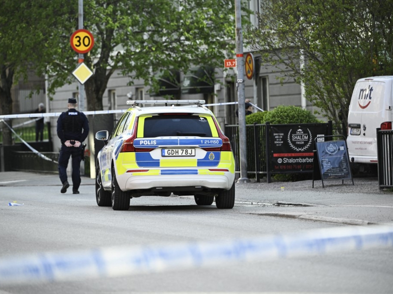 Swedish police arrest four over shooting, release teen