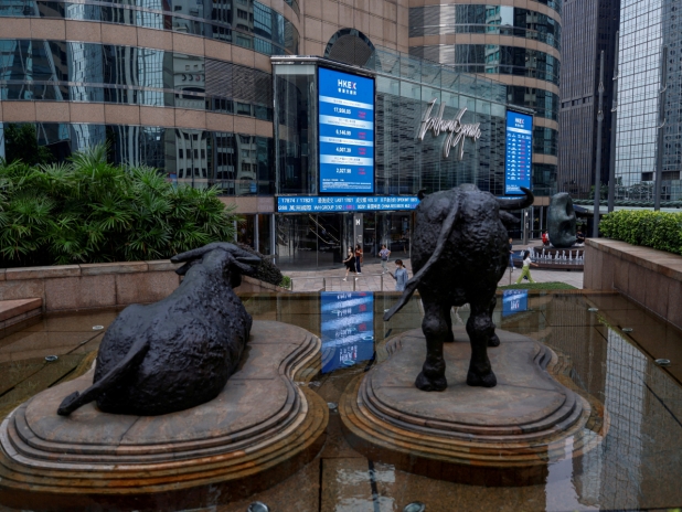 HK stocks slip as risk appetite lifts markets up north