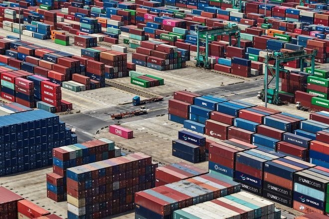China's exports to U.S. sink, offset by trade with other economies, as U.S. tariffs hit global trade