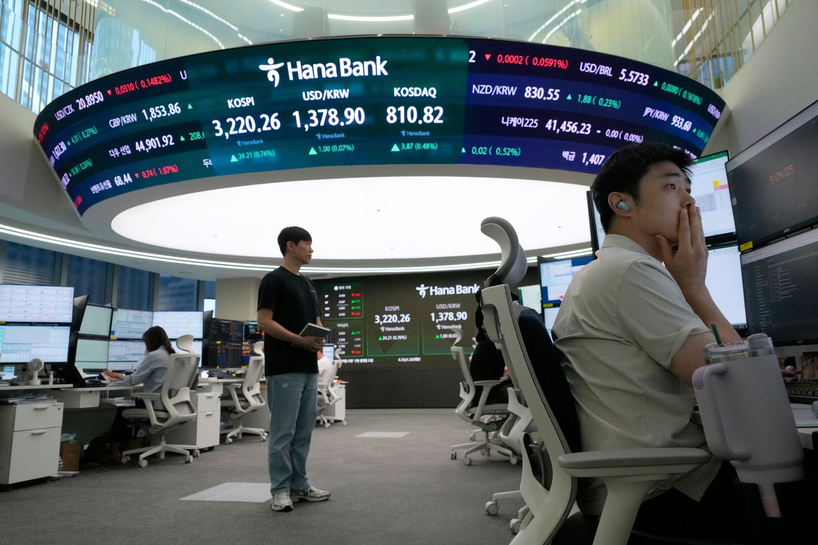 Asian shares are mixed after Wall Street sets more records for U.S. stocks