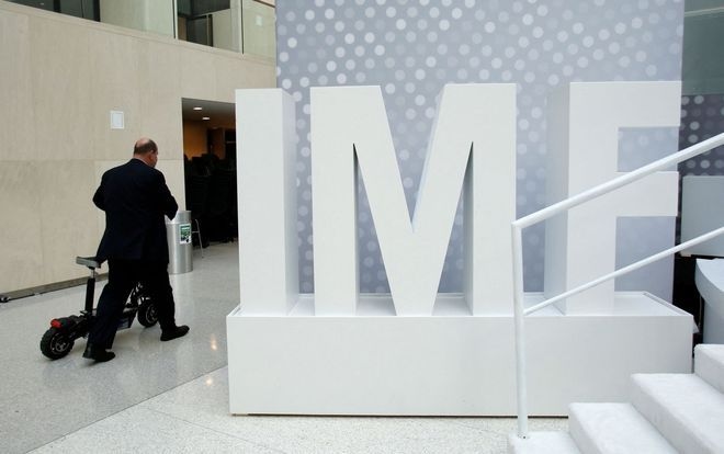 IMF upgrades outlook for global economy, citing less-than-expected damage from Trump's trade wars