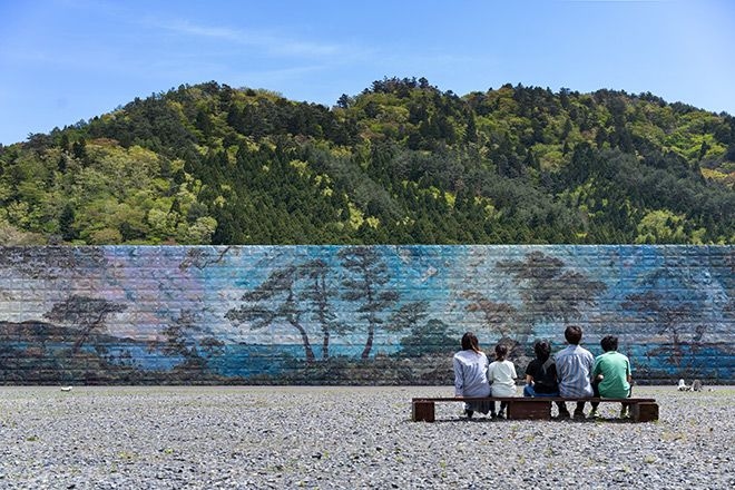 Concrete tsunami seawall serves as massive canvas for artists