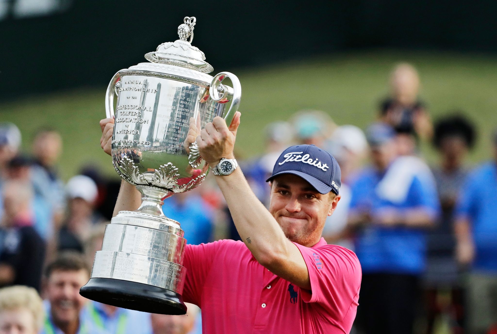 Don't drop it! The PGA Championship's 27-pound Wanamaker Trophy can be a beast to hoist