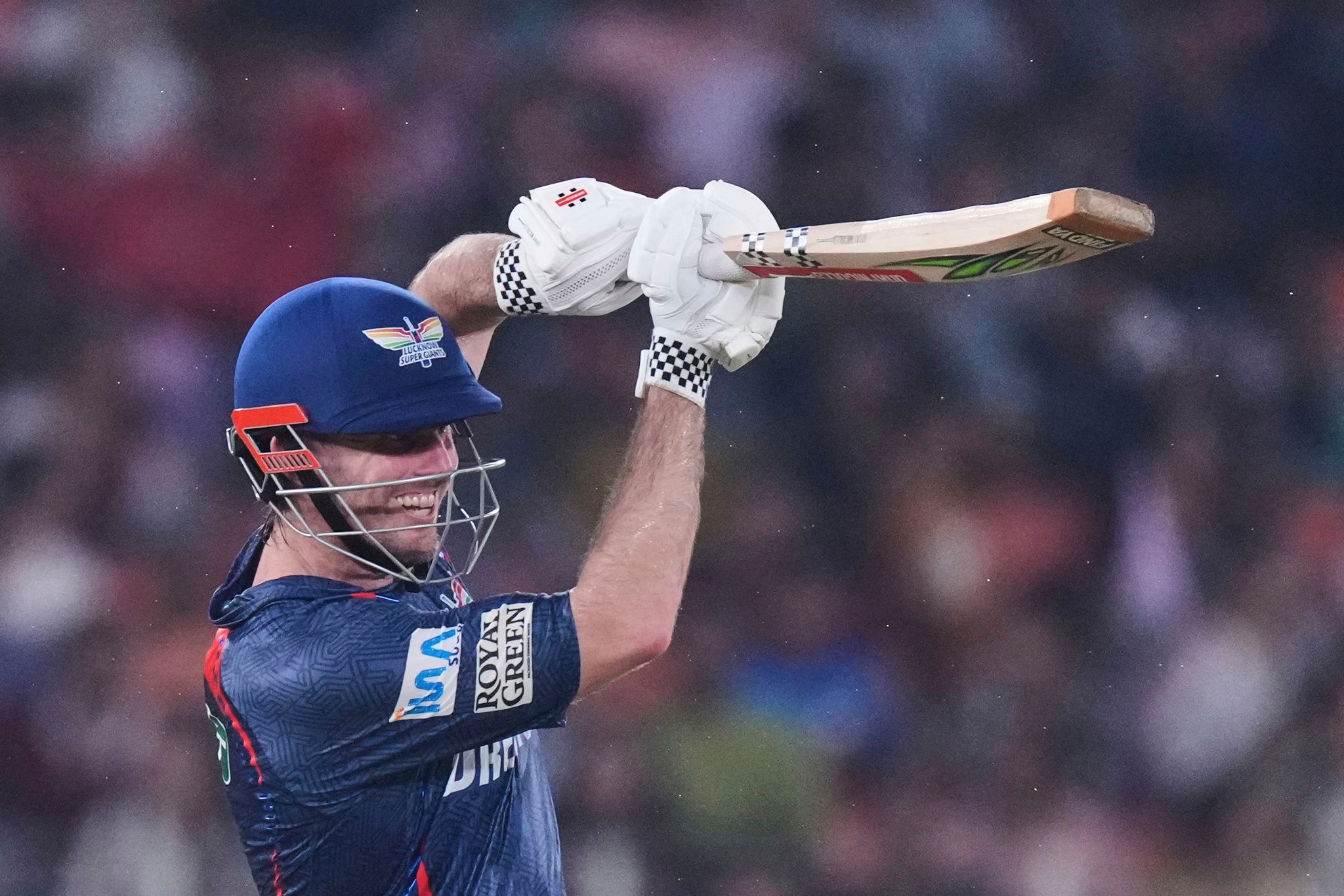 Marsh's century earns Lucknow a 33-run win over IPL-leading Gujarat