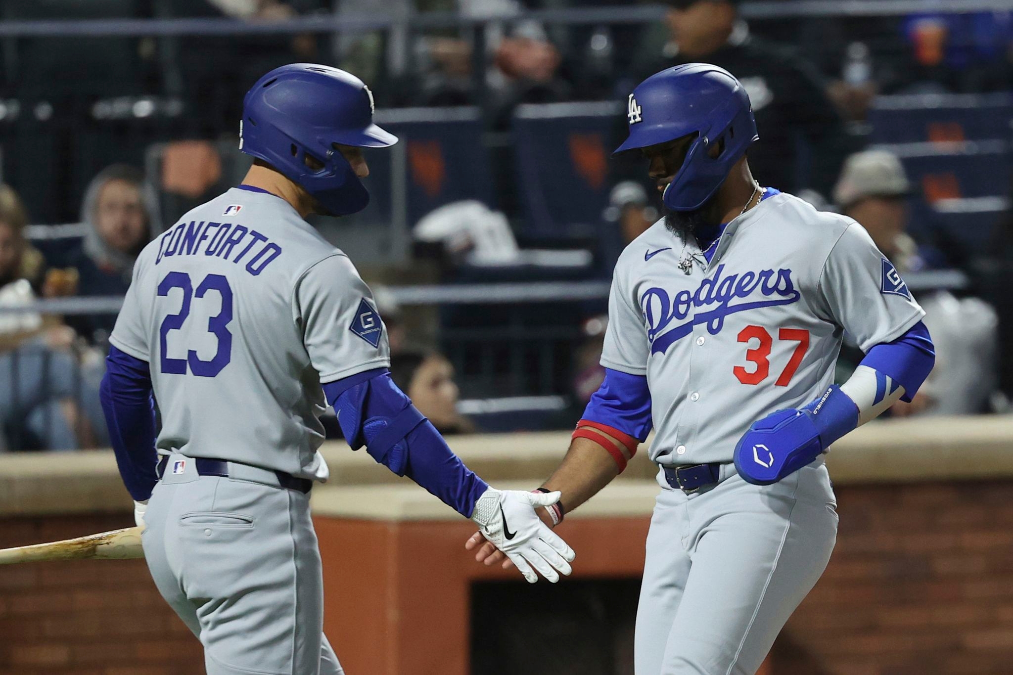 Hernández sends Dodgers past Mets 7-5 in 13 innings in wild and rainy NLCS rematch