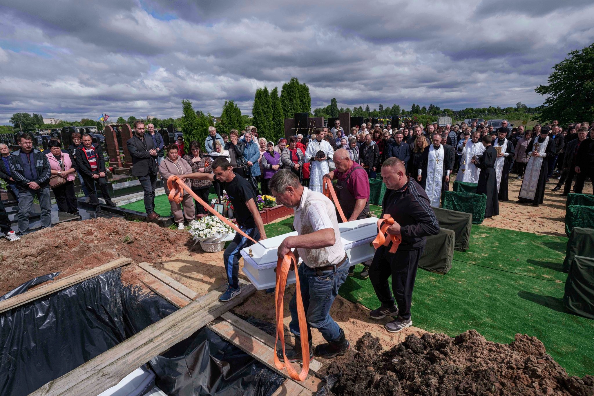 Funeral of 3 siblings killed in Russian strike underscores mounting toll on Ukrainian families