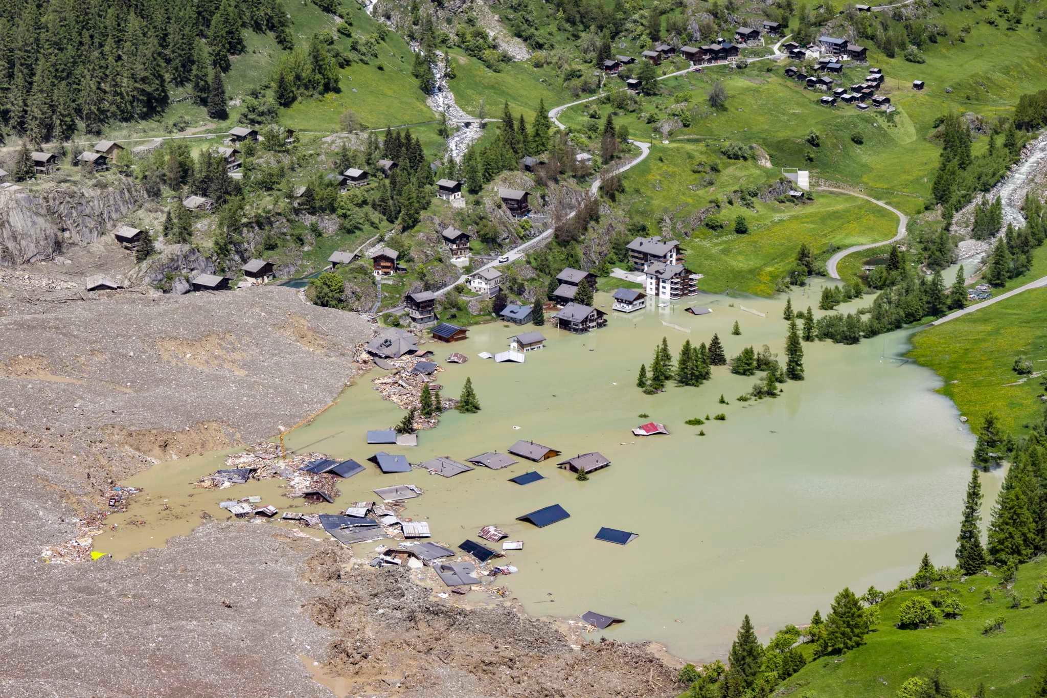 Swiss glacier collapse renews focus on risks of climate change as glaciers retreat around the world