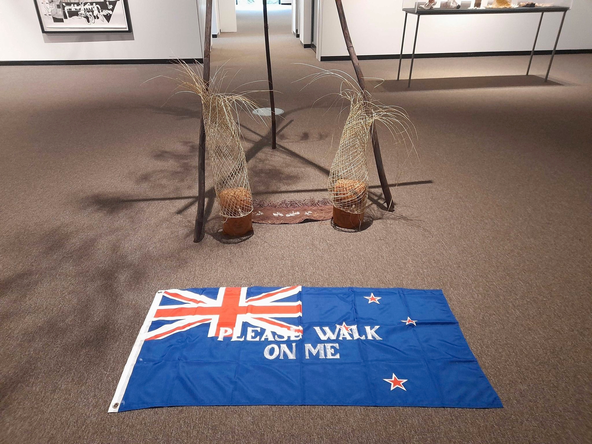Protests over ‘please walk on me' flag artwork prompt its removal from New Zealand gallery — again