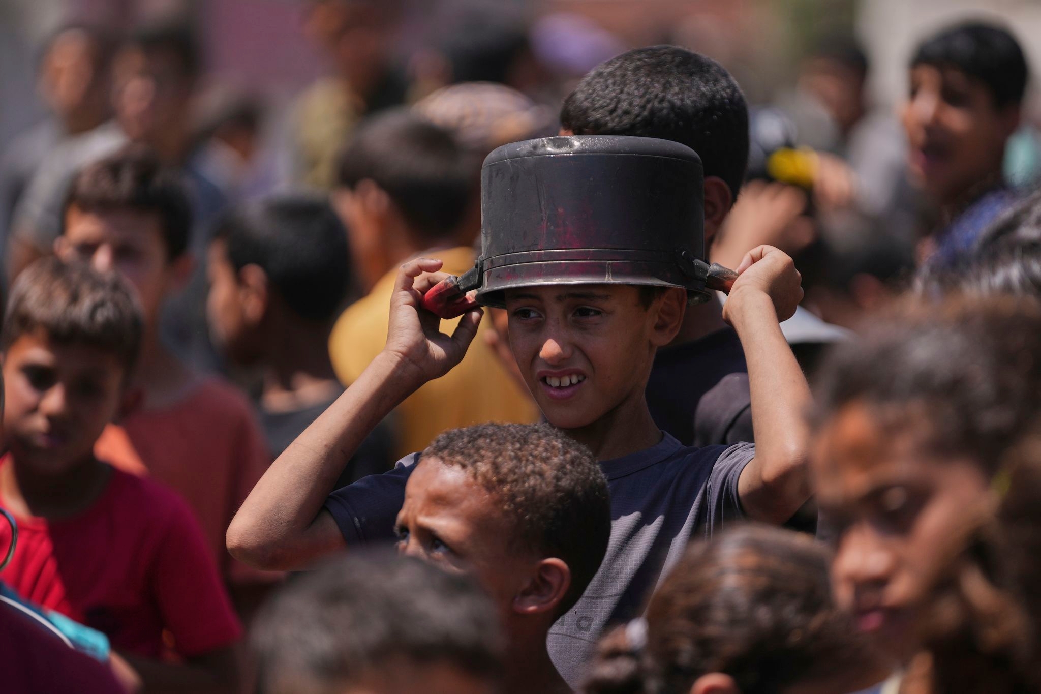 Hungry Palestinians in Gaza block and offload dozens of UN food trucks
