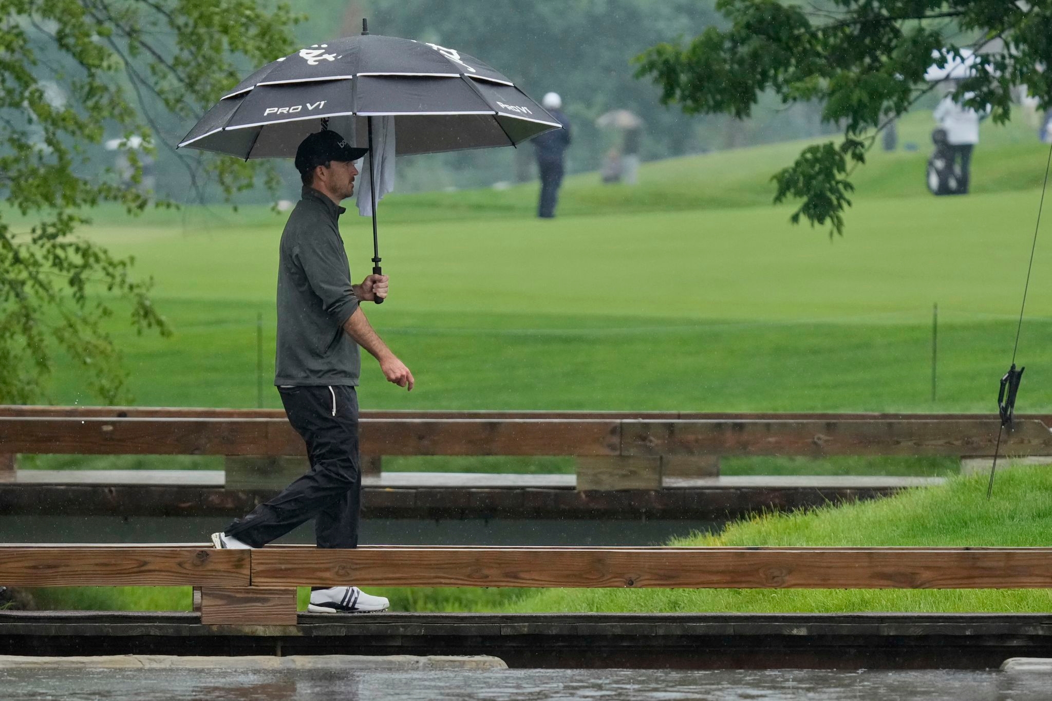 Nick Taylor makes it look easy in the rain and shares the lead at Memorial