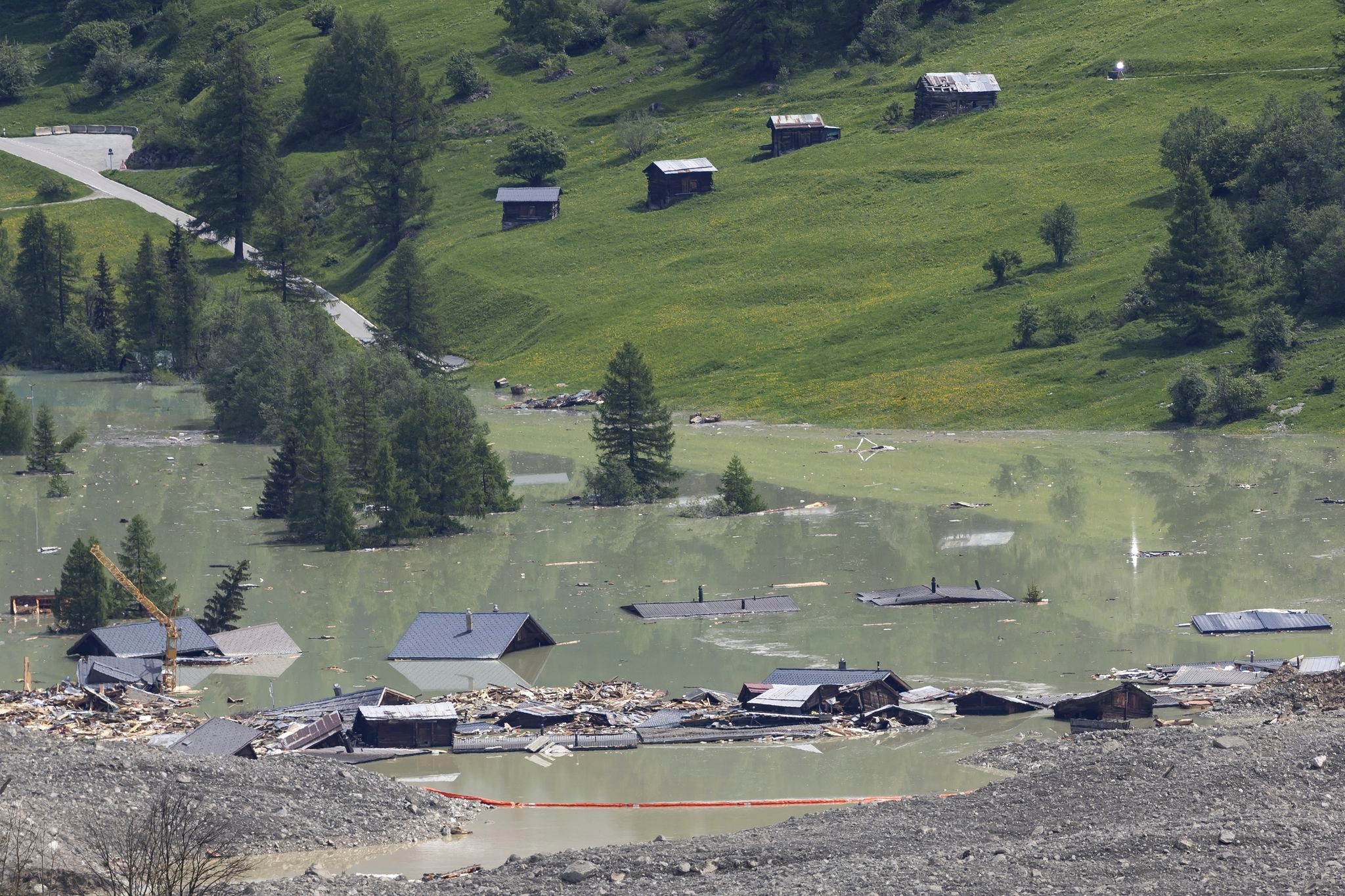 A river dammed by a huge Swiss landslide is flowing again. That's a relief to authorities