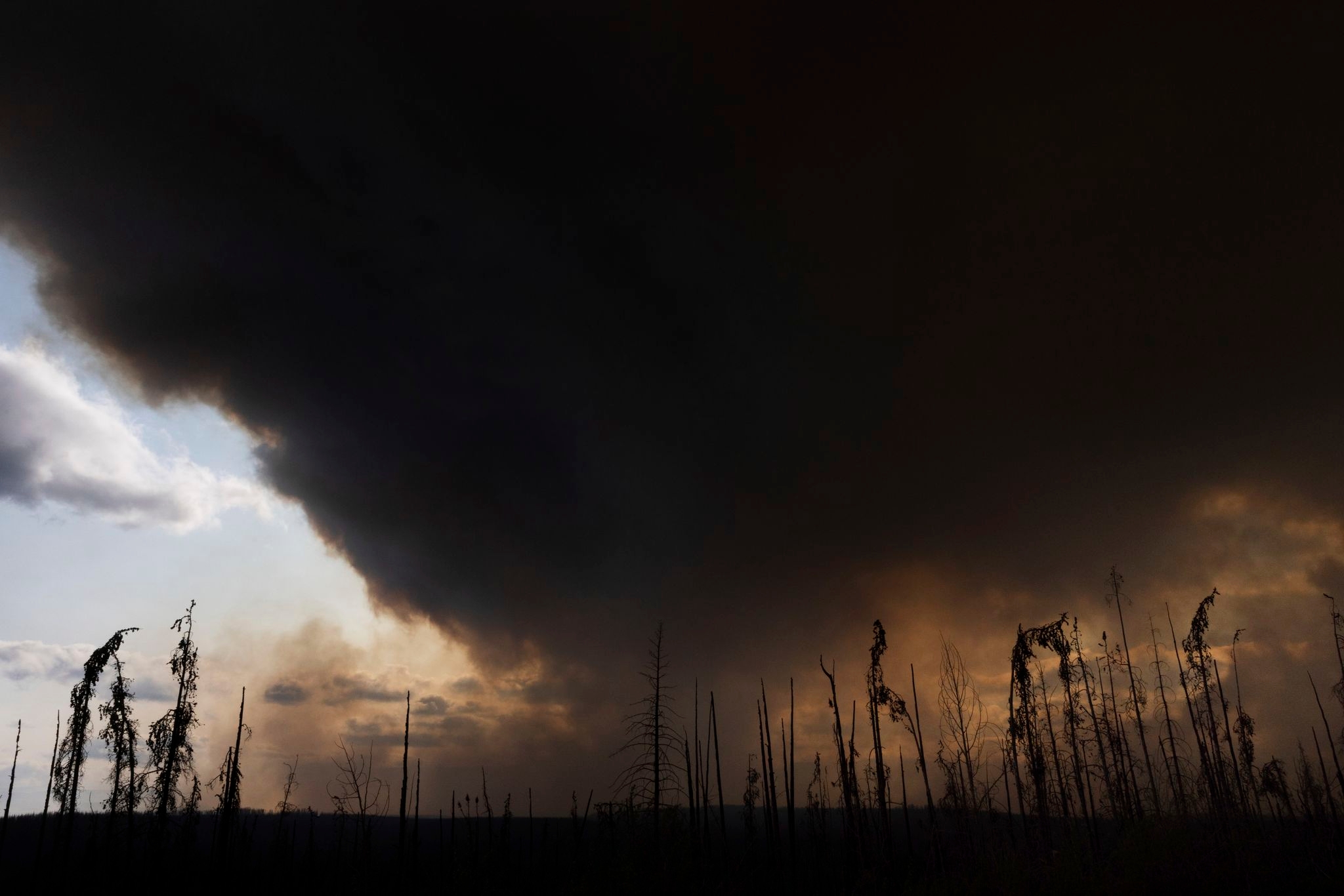 Wildfires burning across central Canada force additional evacuation orders and more shelters to open