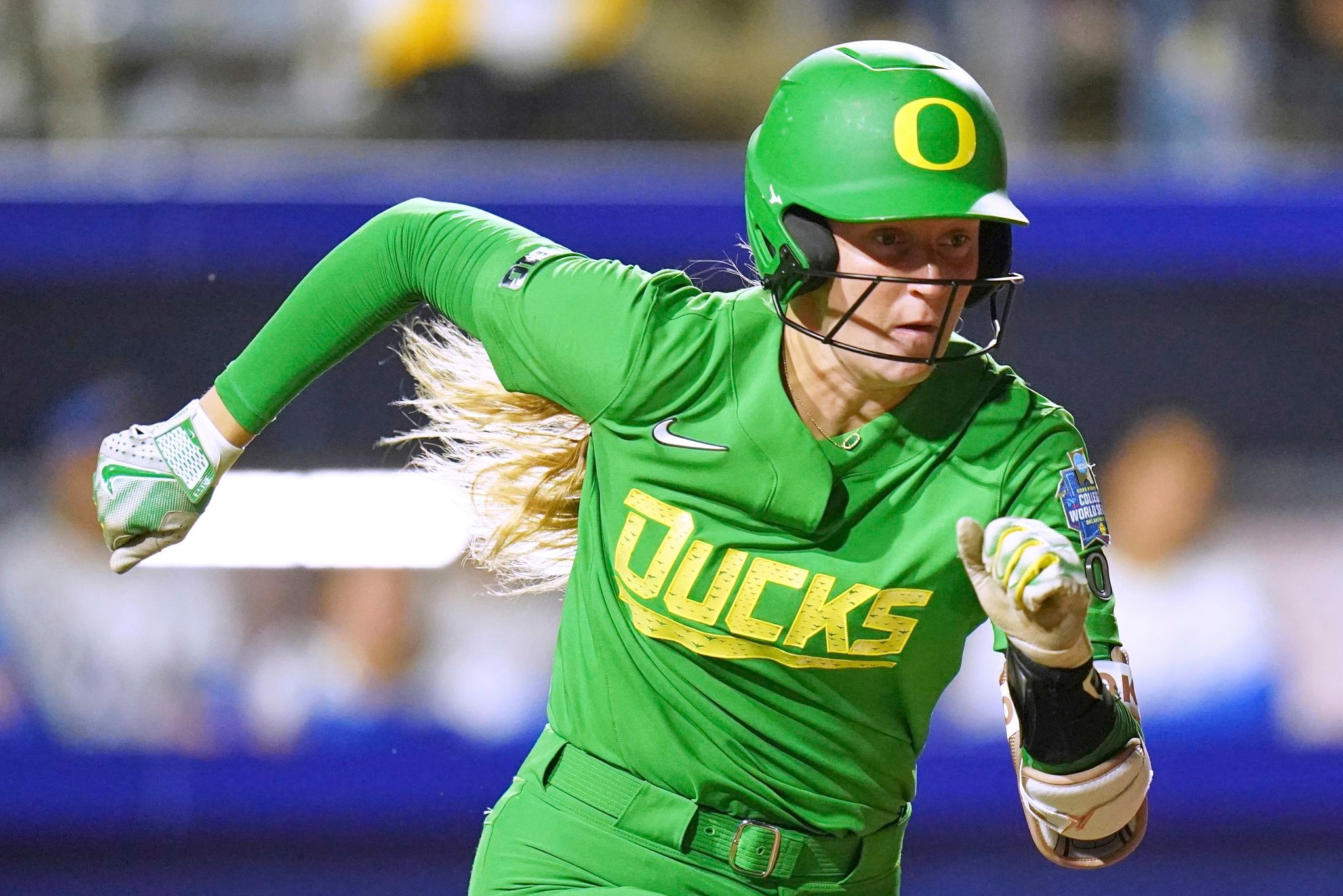 Here's dirt in your eye. Freak pitch strikes airborne clod, and Oregon softball catcher pays price