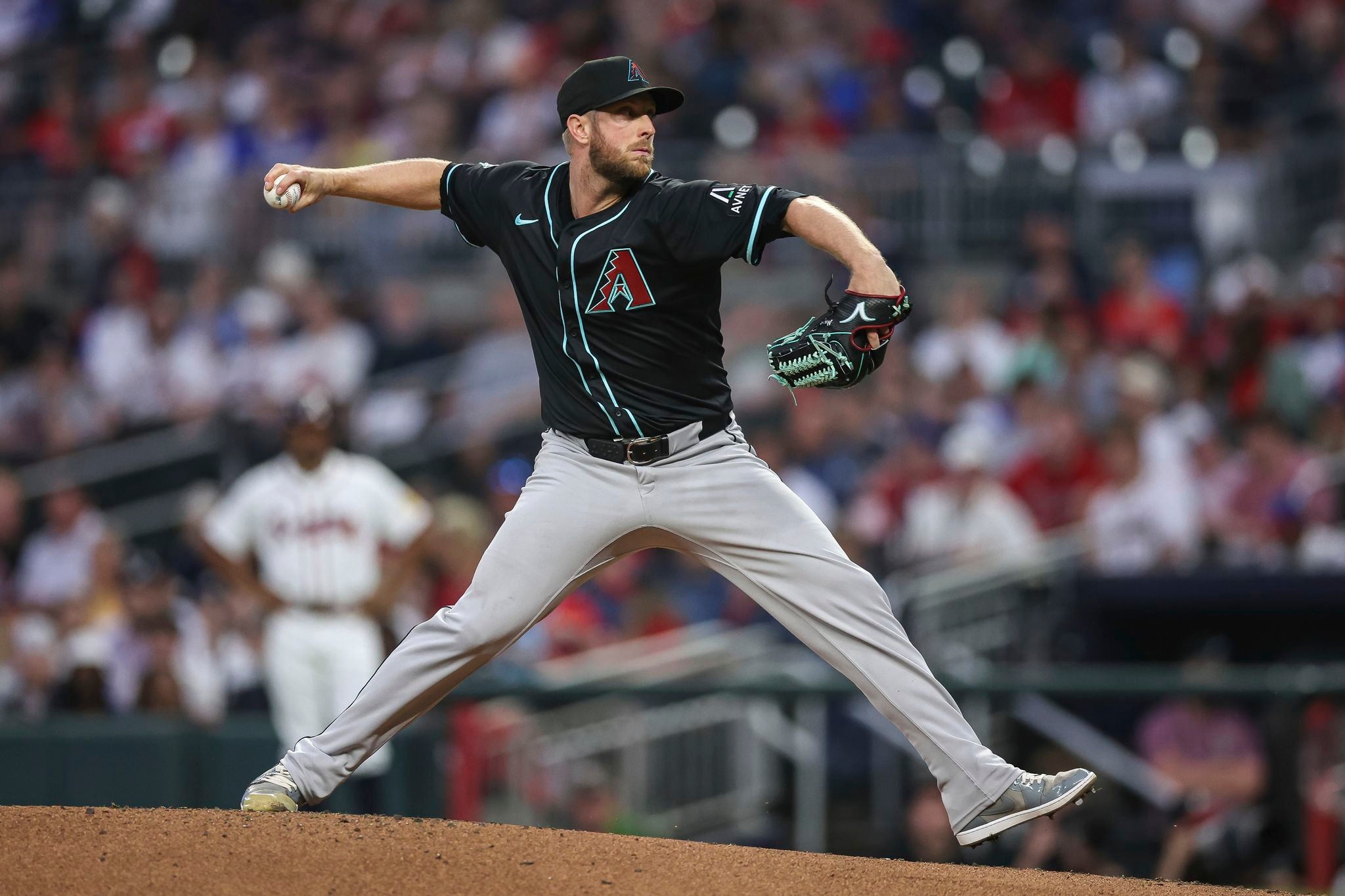 Merrill Kelly outduels Chris Sale and Diamondbacks hold off Braves 2-1