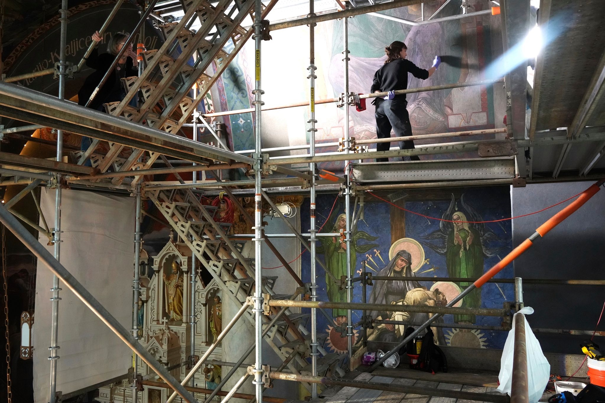AP PHOTOS: Famed church murals featuring social commentary revived by conservationists