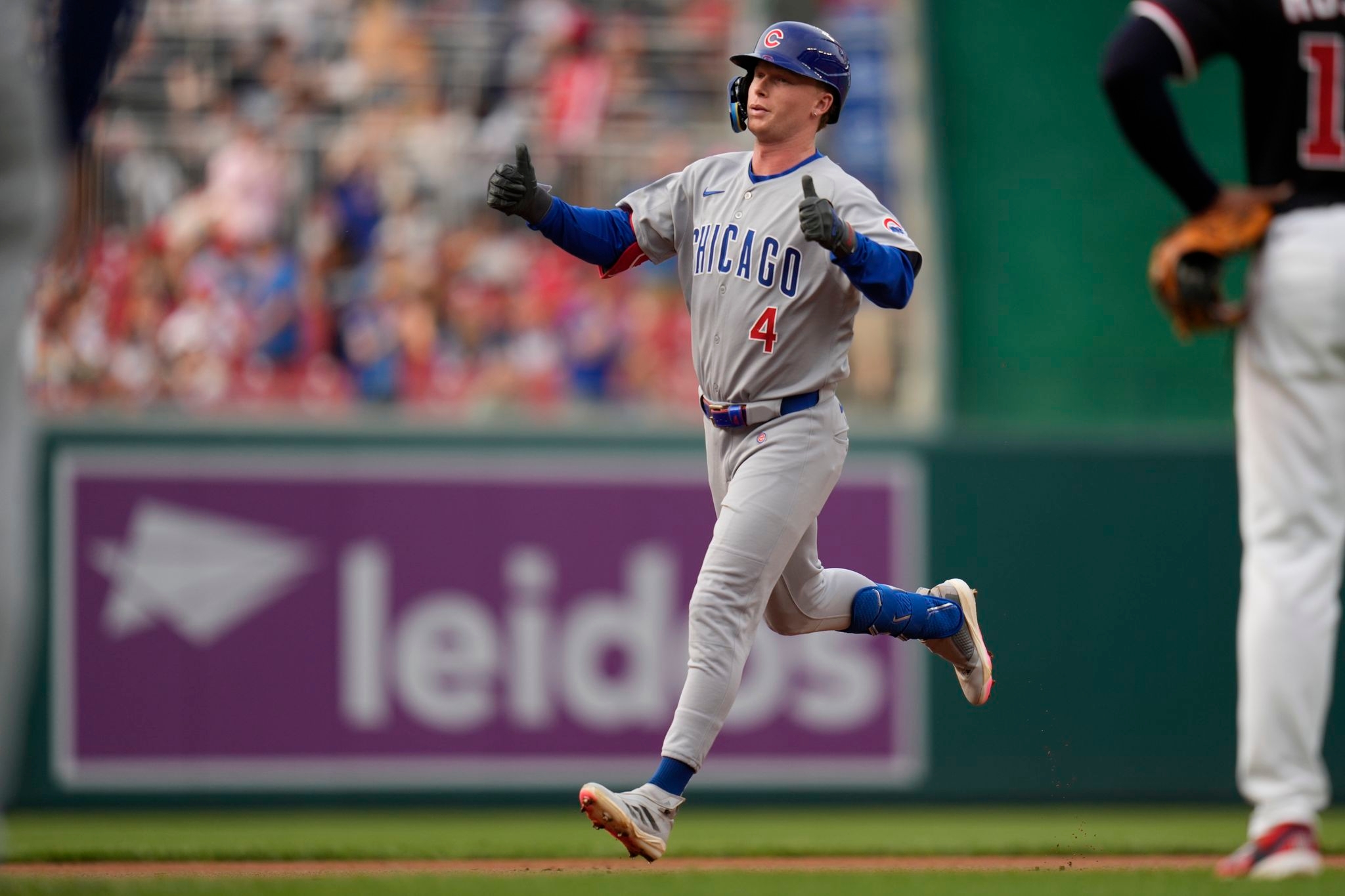 Happ homers, has 4 RBIs on 3 hits as Cubs down Nats 7-1