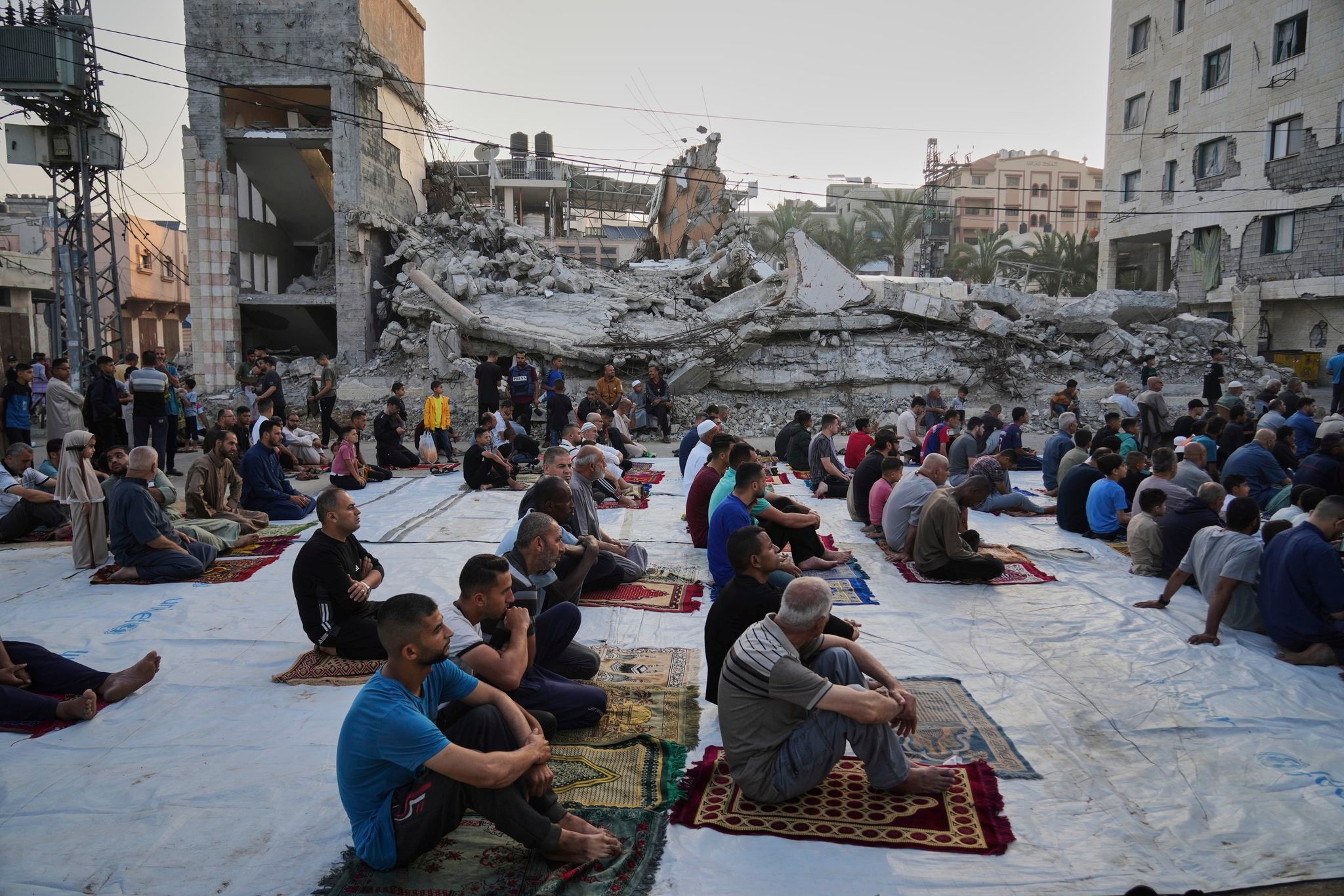 Gaza marks the start of Eid with outdoor prayers amongst the rubble and food growing ever scarcer