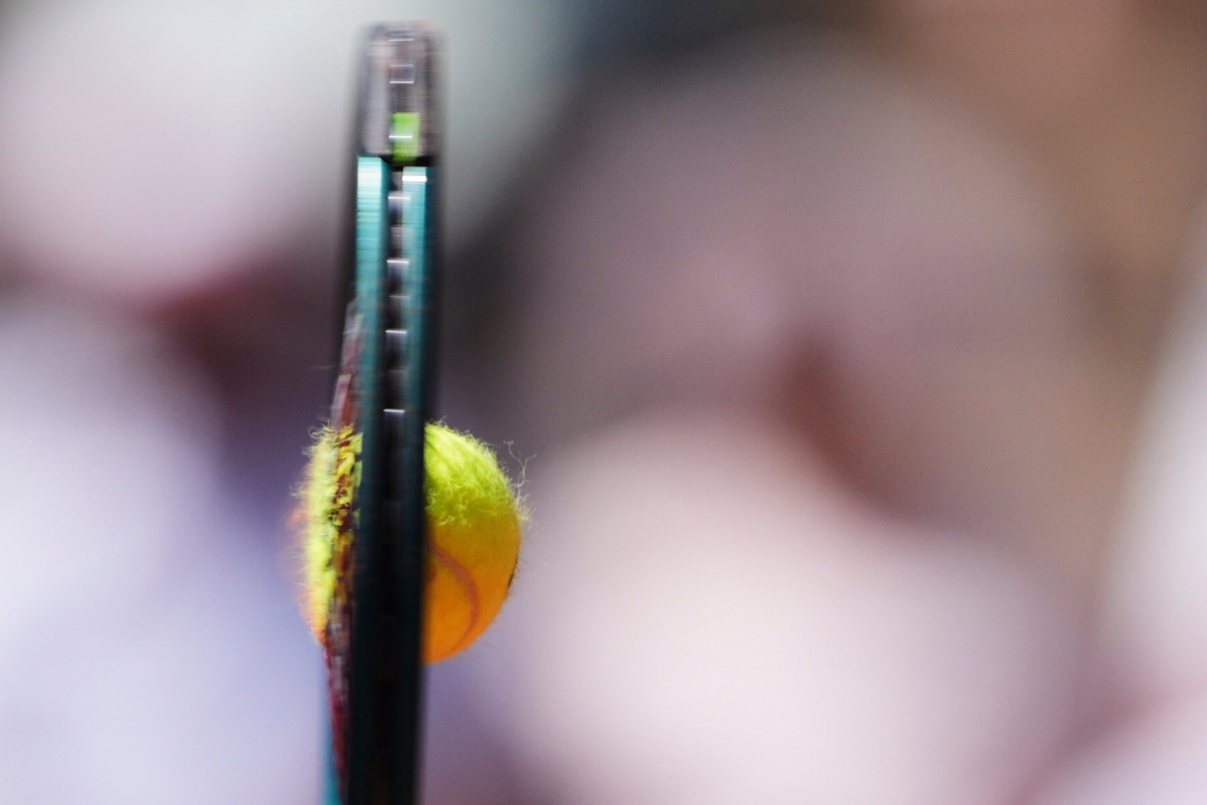 AP PHOTOS: Tattoos, clay and bouncing hair bring the French Open to life