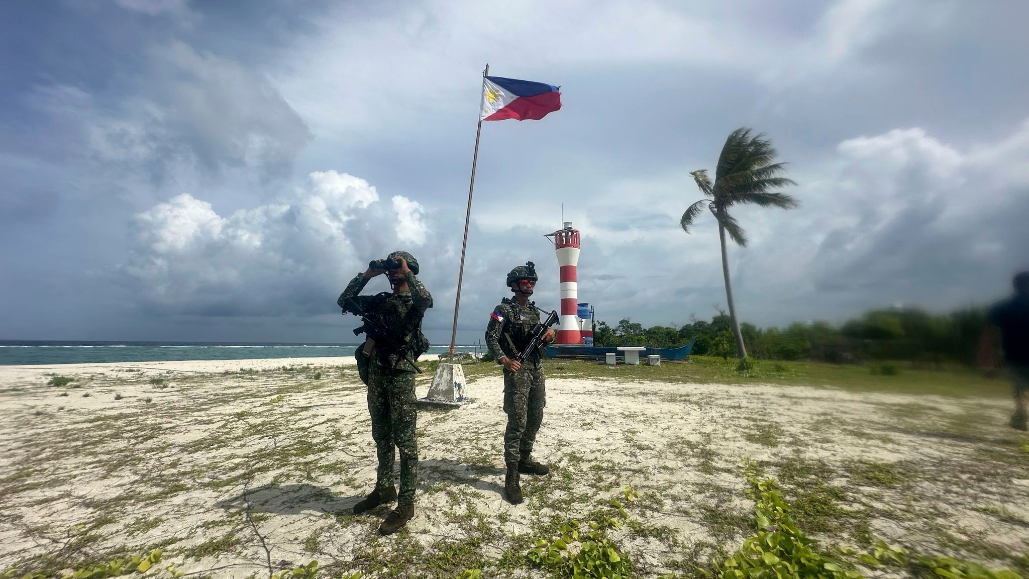 Filipino forces and villagers struggle to live in China's shadow in disputed waters