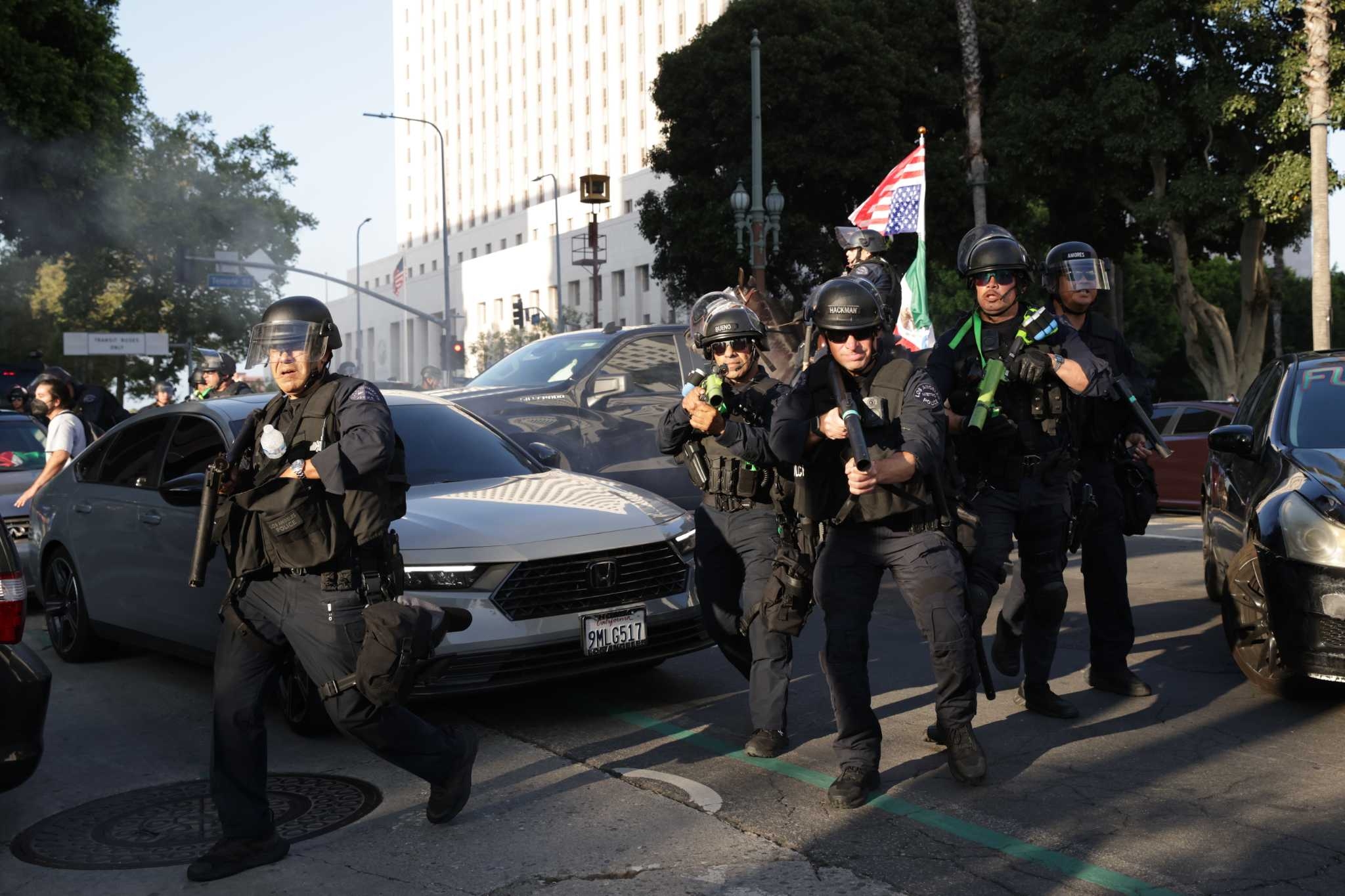LAPD fires flash-bang grenades, less-lethal rounds at protesters