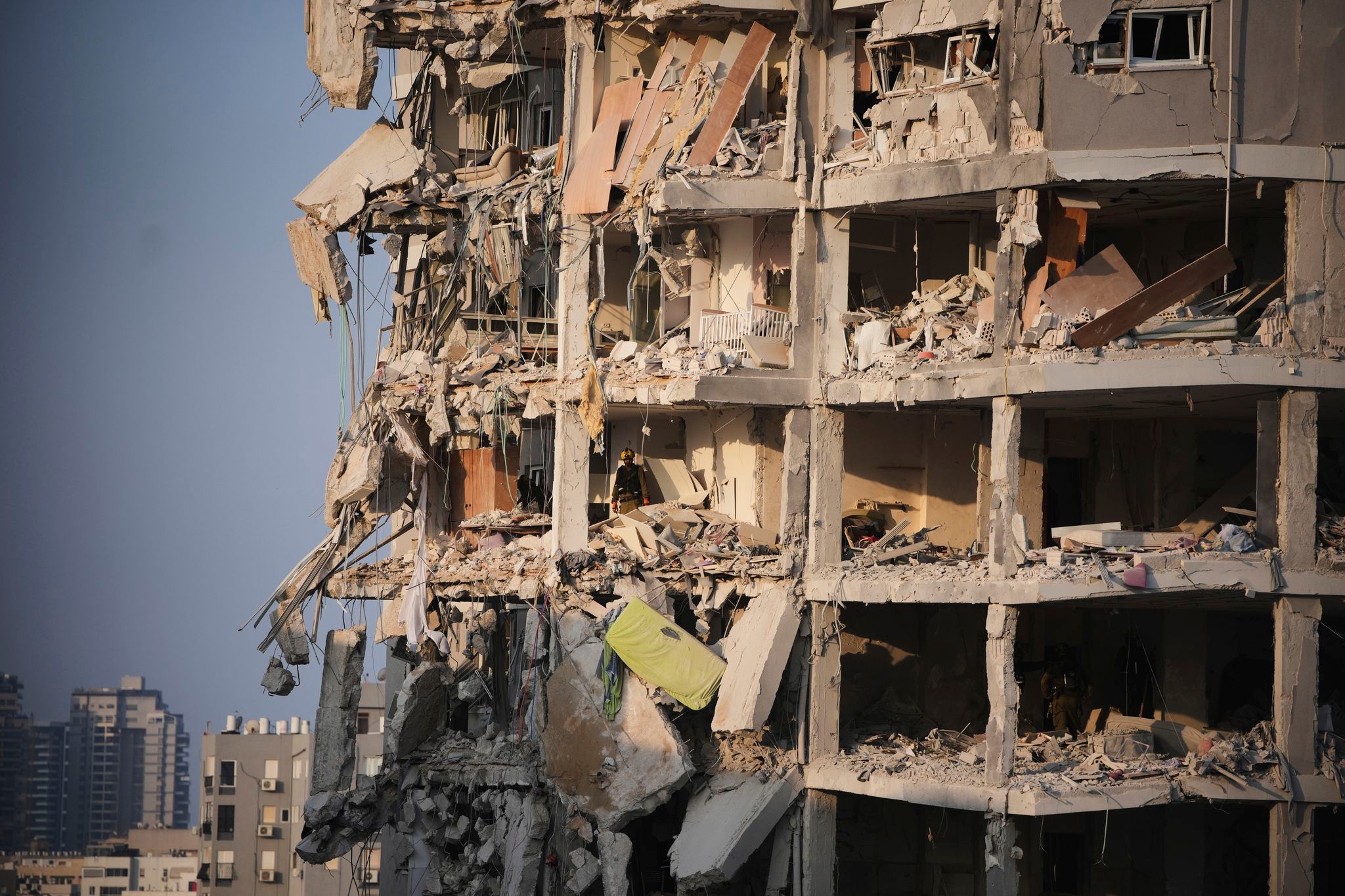 The Latest: Death toll grows as Israel and Iran trade attacks for third day