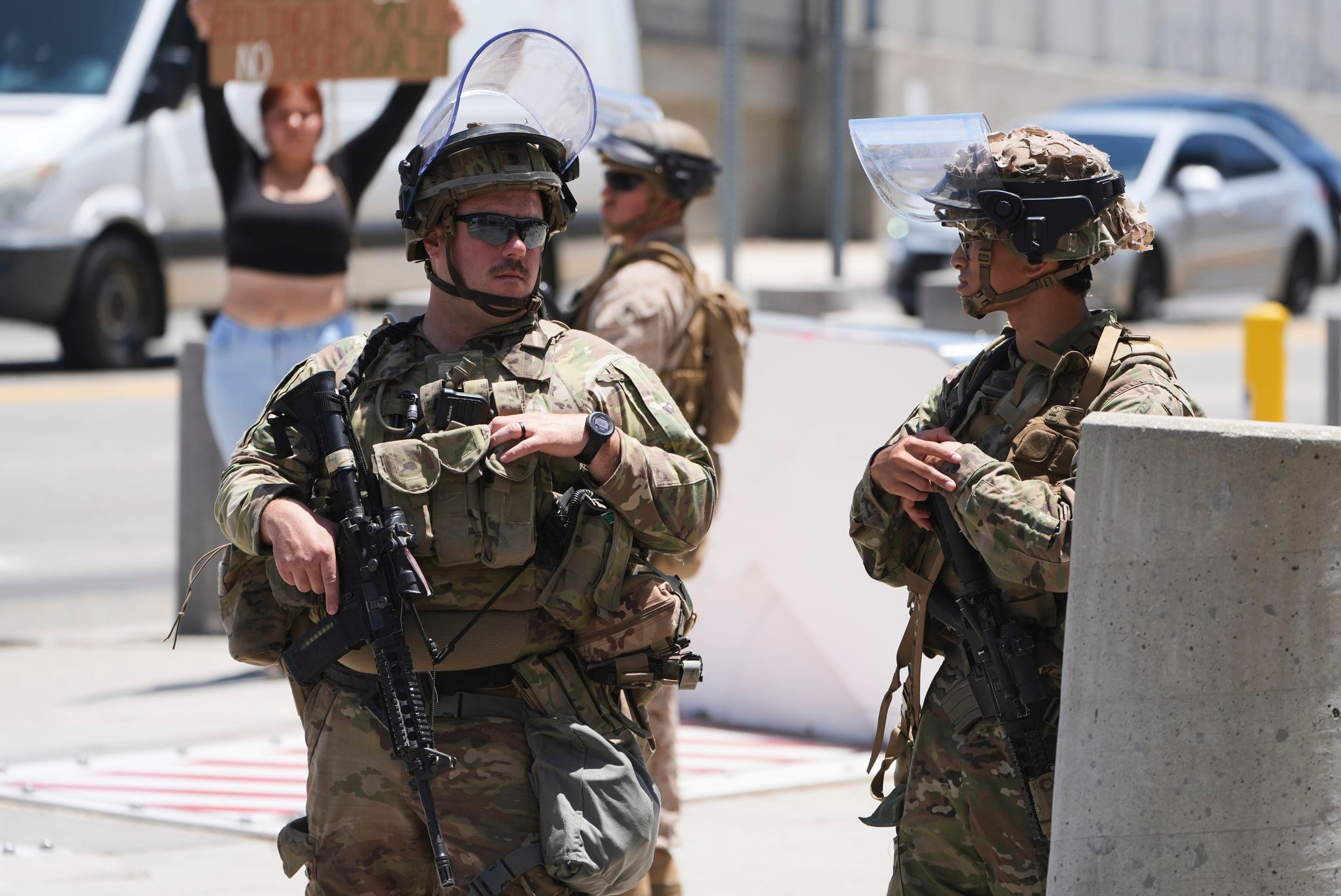 The Latest: Trump weighing moves against Iran and widens use of military in US