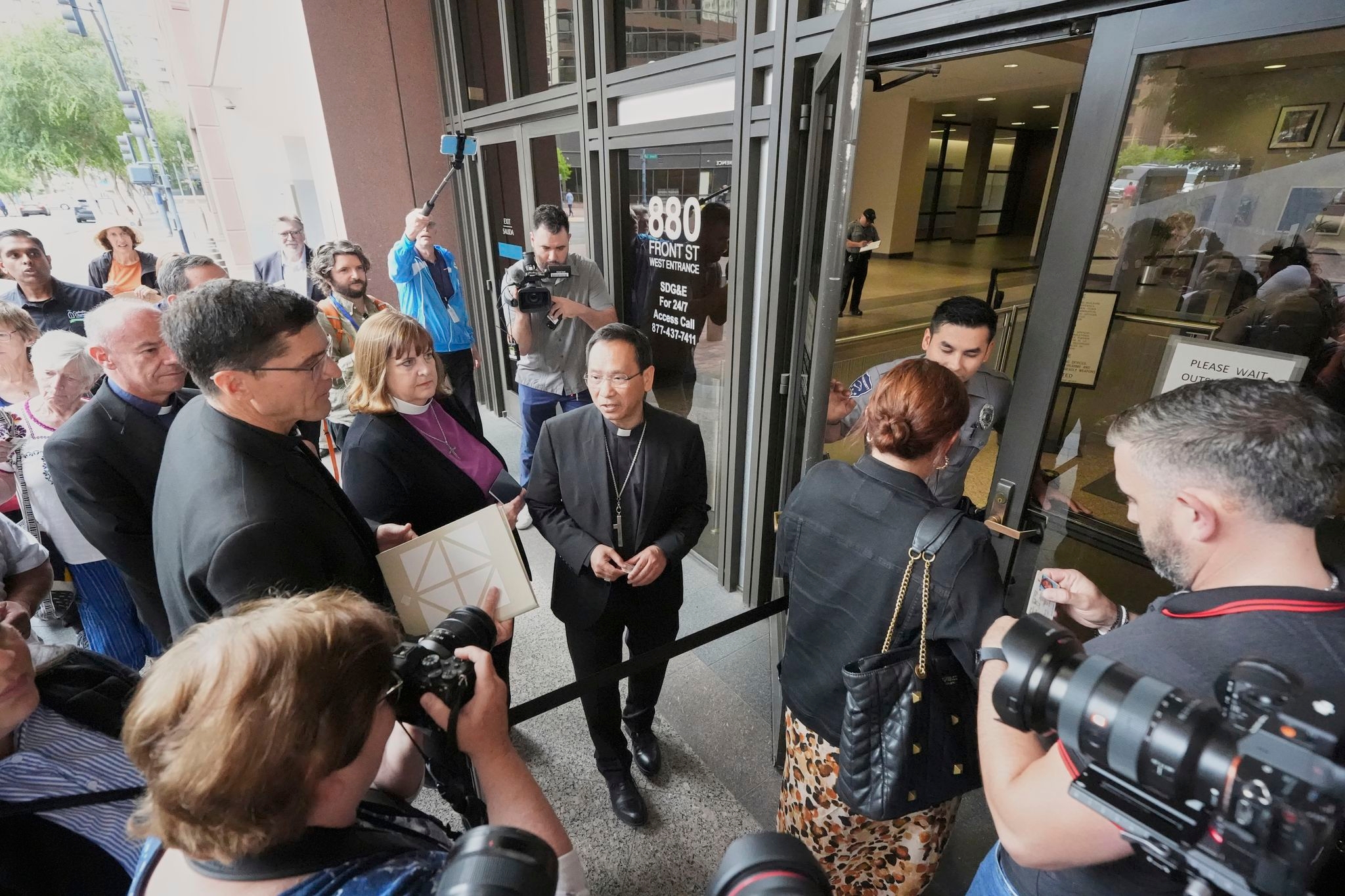 San Diego clergy visit federal immigration court to bear witness during crackdown on migrants