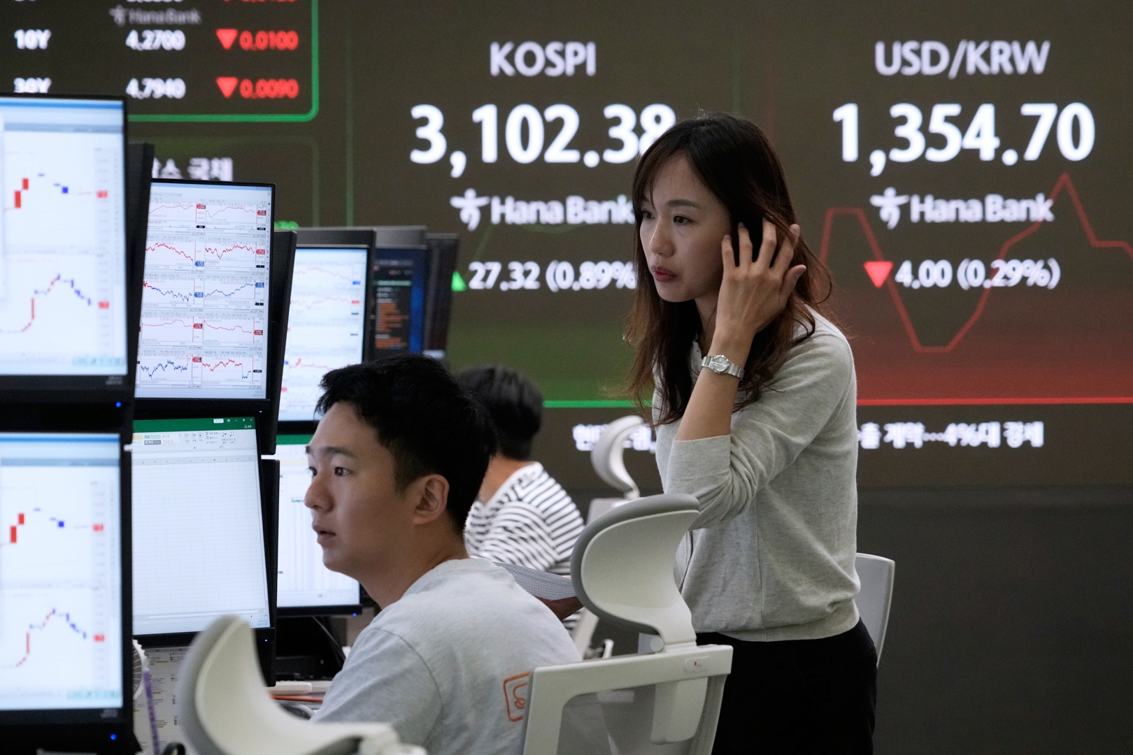 Asian shares mostly higher after US stocks hit another record as Tesla and Nike rally