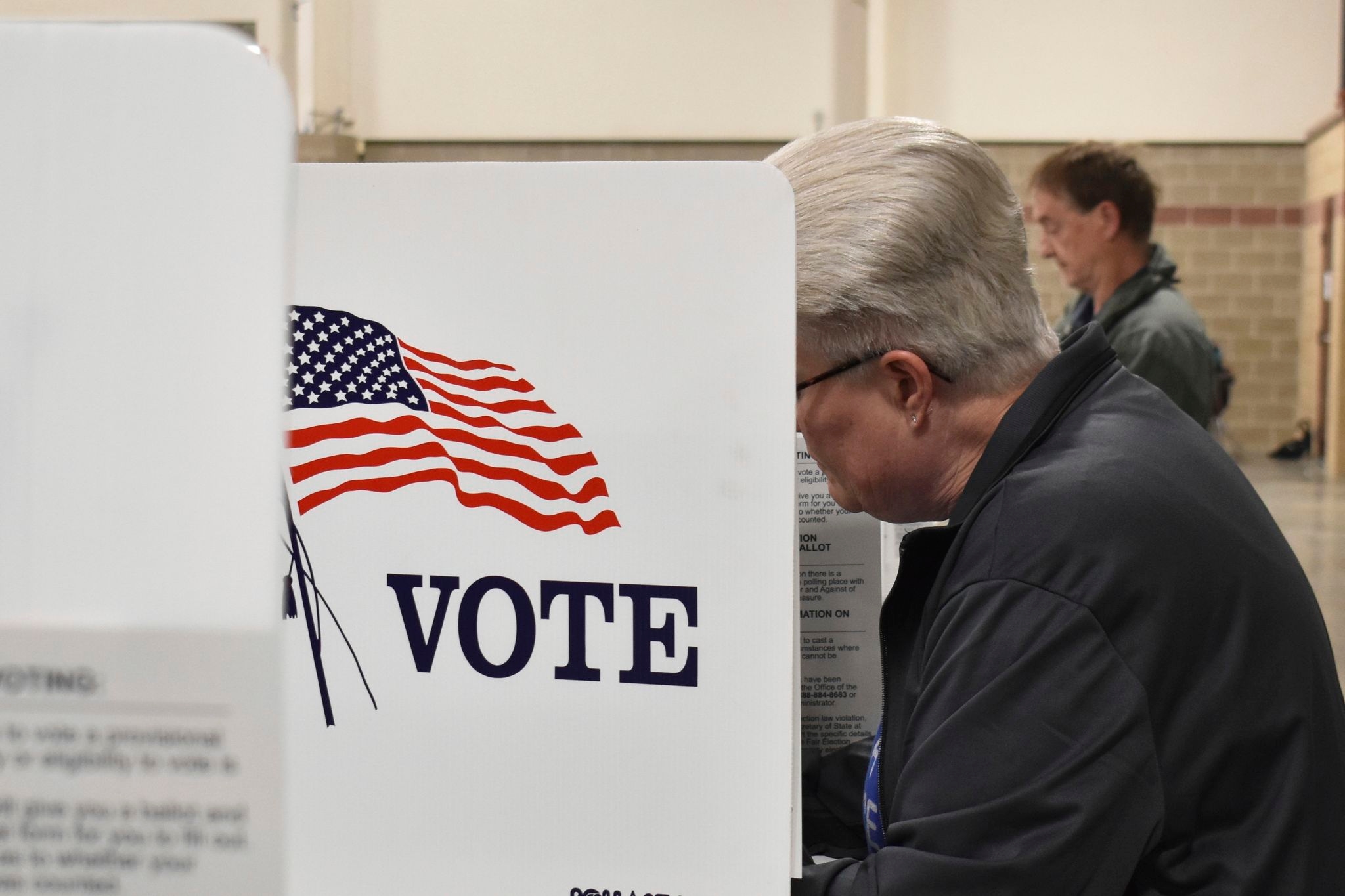 Judge limits a small part of a court order blocking Trump's election overhaul as lawsuits continue
